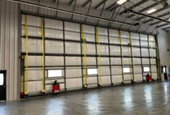 Switchback Helicopters chooses strap over cable for new hangar door