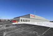 Retailer to double distribution employees at new site – but that trails job targets of previous owne